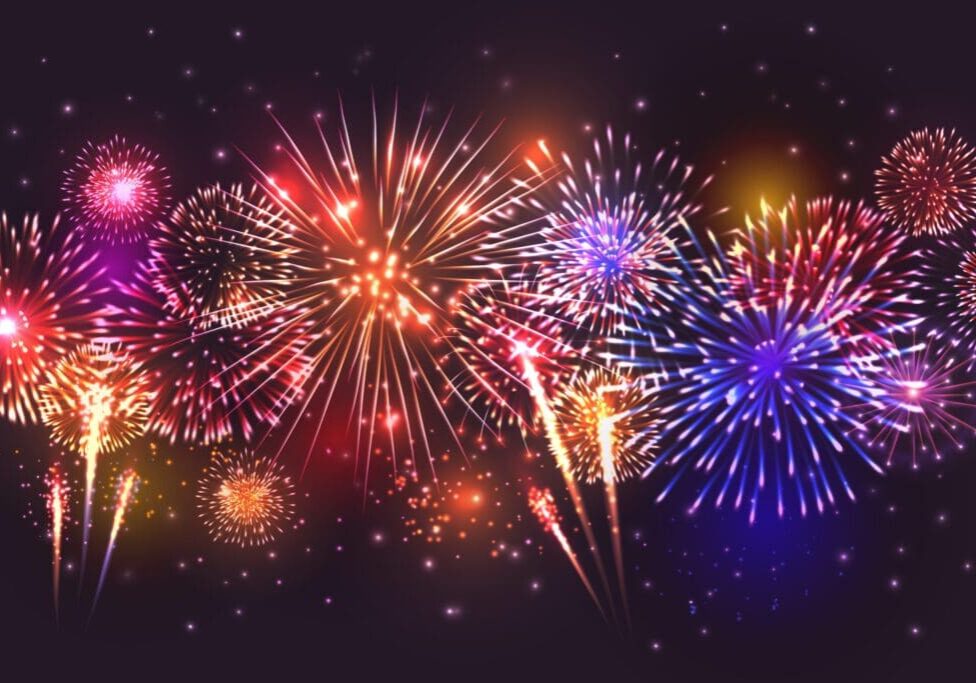 Colorful fireworks bursting against a dark night sky.