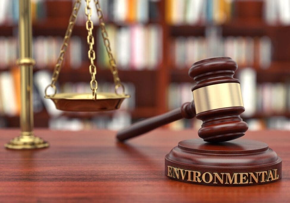 A gavel and scales of justice symbolize environmental law.