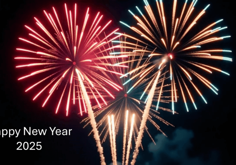 Colorful fireworks bursting in the night sky to celebrate New Year 2015.