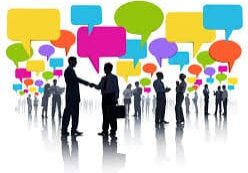 Silhouettes of people communicating with colorful speech bubbles above.