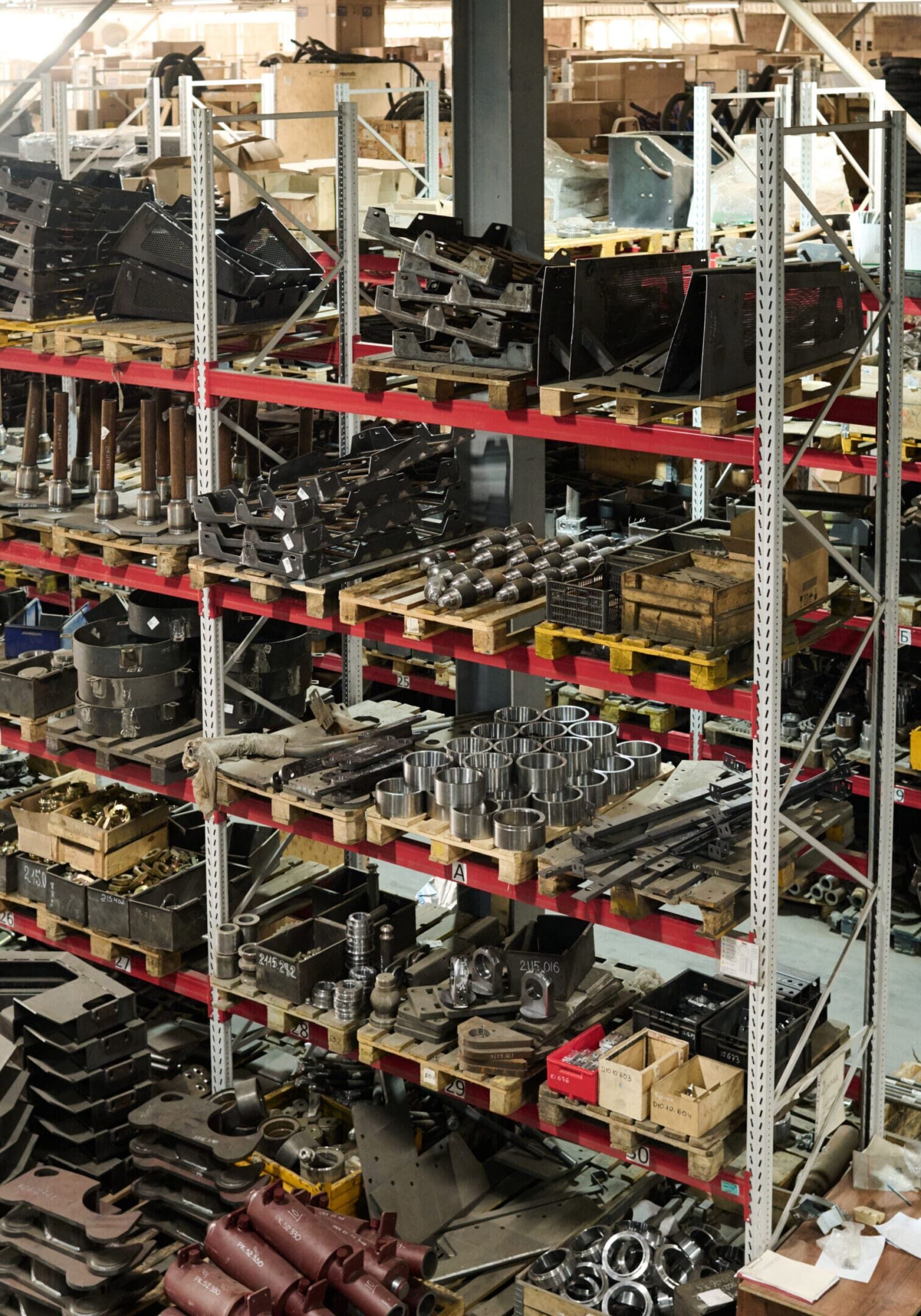 Shelves filled with organized automotive parts in a workshop.